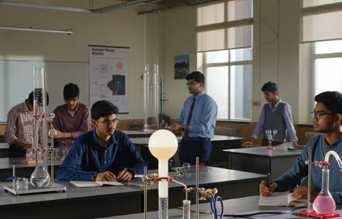 group-students-are-sitting-table-with-globe-it (1)